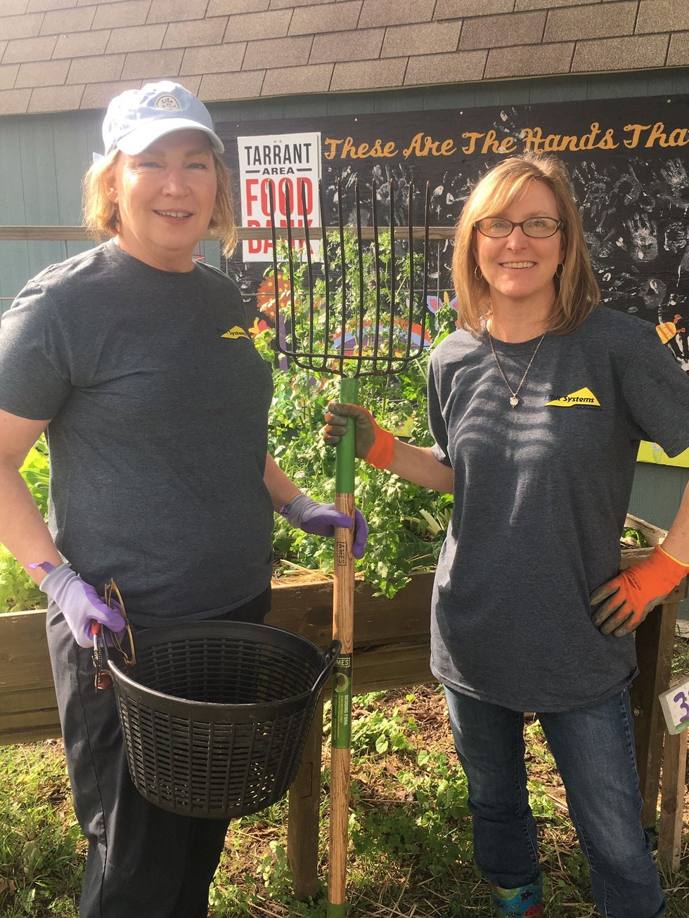 Elbit Systems of America employees Karen Skjolsvik and Zane Smith at Tarrant Area Food Bank Community Garden, 2019
