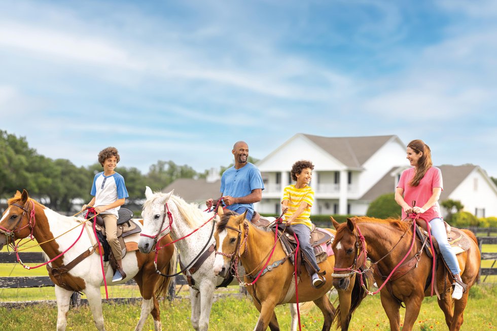 95593500_family_horseback_riding_at_southfork_ranch__high_res_for_web.jpg