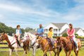 95593500_family_horseback_riding_at_southfork_ranch__high_res_for_web.jpg